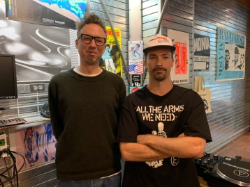 Tony Remple (left) owns record store Musique Plastique, pictured with Dane Overton (right), who live streams Intro to Rhythm internet radio station from inside the store.