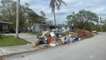 About a month after Hurricane Ian made landfall near Fort Myers, piles of debris lined the streets.