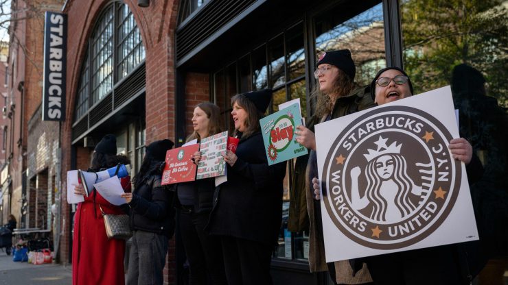 Starbucks workers on strike at a Starbucks coffee shop in Brooklyn, New York.