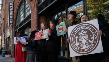 Starbucks workers on strike at a Starbucks coffee shop in Brooklyn, New York.
