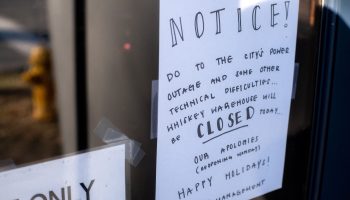A sign on a bar window in Charlotte, North Carolina reads: Notice! Do to the city's power outage and some other technical difficulties ... Whiskey Warehouse wile be closed today.... Our apologies (reopening Monday) Happy holidays! Management. a