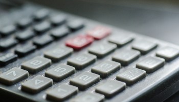 The keyboard of a calculator.