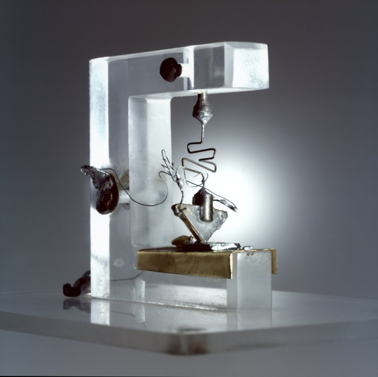 The first transistor sits on a small pedestal in a Nokia Bell Labs showroom.