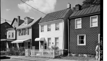A black-and-white photo of a row of houses in what is now Philadelphia.