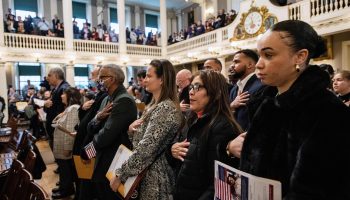 New U.S. citizens are sworn-in during a naturalization ceremony at Faneuil Hall in Boston, Massachussetts, on January 5, 2023.