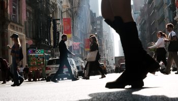 People walk down a shopping street in Manhattan on October 26, 2022 in New York City.