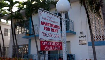 An 'Apartments for Rent' sign hangs in front of a building on December 06, 2022 in Miami Beach, Florida.