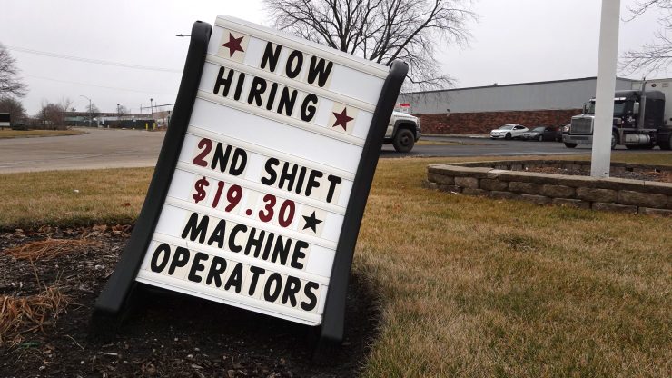 A sign advertises job openings in Illinois.