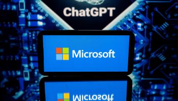 This picture shows screens displaying the logos of Microsoft and ChatGPT, a conversational artificial intelligence application software developed by OpenAI.