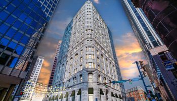 An architectural rendering shows the vision for 210 N. Charles Street in Baltimore, known as the Fidelity Building, an old office tower being converted to apartments.