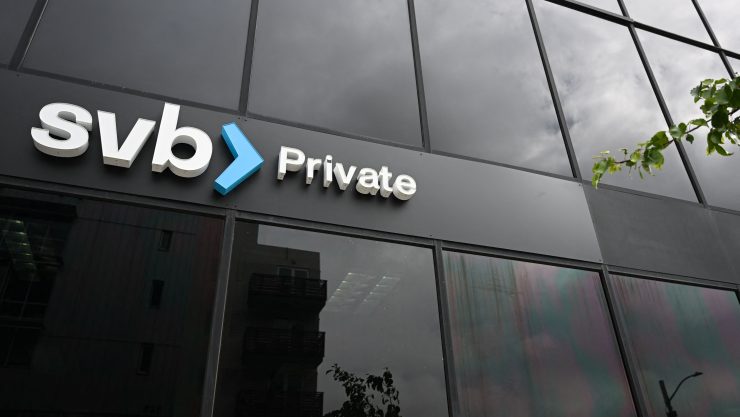 The logo for SVB private is seen against a black window building.