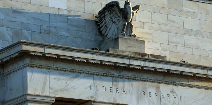 The words "Federal Reserve" are stamped into marble on the exterior of the Fed building, underneath a marble statue of a bald eagle.