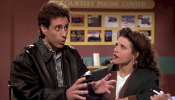 Jerry Seinfeld stands next to Julia Louis Dreyfus in a screenshot from "Seinfeld."