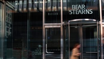 A woman walks out of Bear Stearns headquarters March 24, 2008 in New York City.