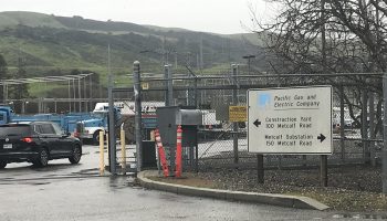 A sign indicates the entrance of the Metcalf Transmission Substation.
