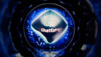 A screen displaying the logo of ChatGPT, the conversational artificial intelligence software application developed by OpenAI, cased inside a orb-shaped object.