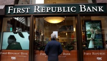 A passerby stops to read a posted announcement from the FDIC about the seizure of First Republic Bank and sale to JPMorgan Chase on May 01, 2023 in San Francisco, California.