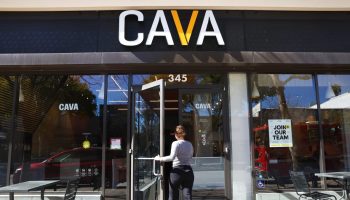 A customer walks into a Cava restaurant.